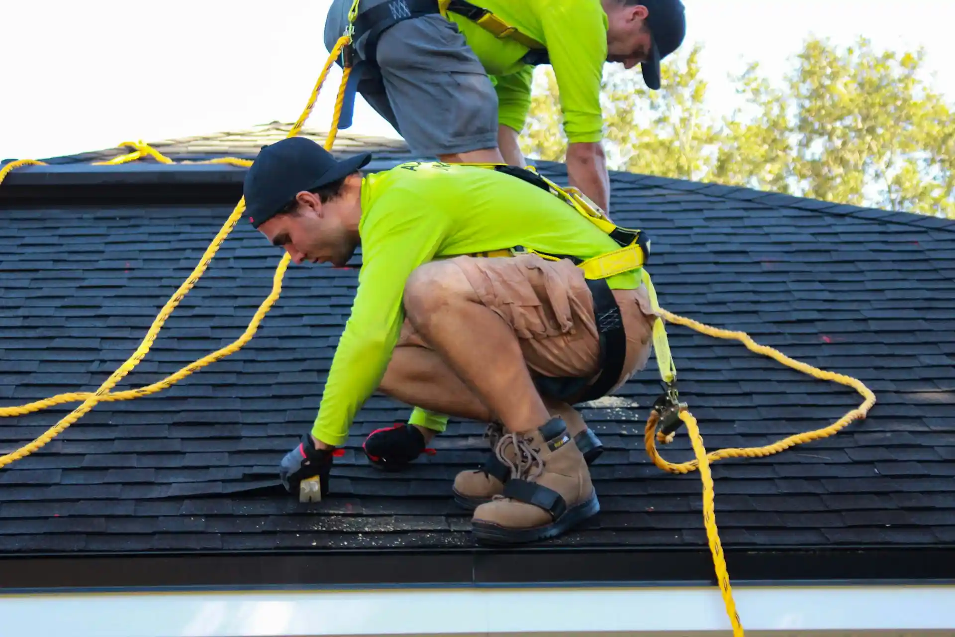 Men on roof installing solar panels